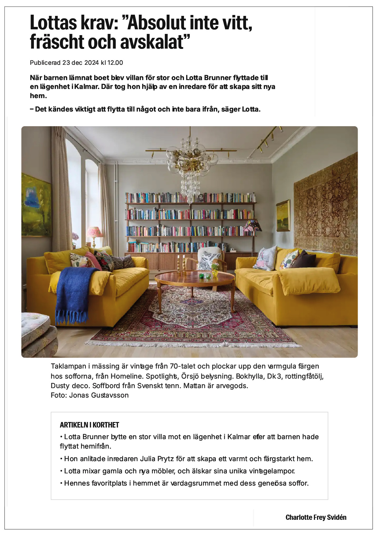 Warm living room with yellow sofas, wooden coffee table, chandelier, and bookshelves. Sweden interior design. Julia Prytz Design. Nordic interior design